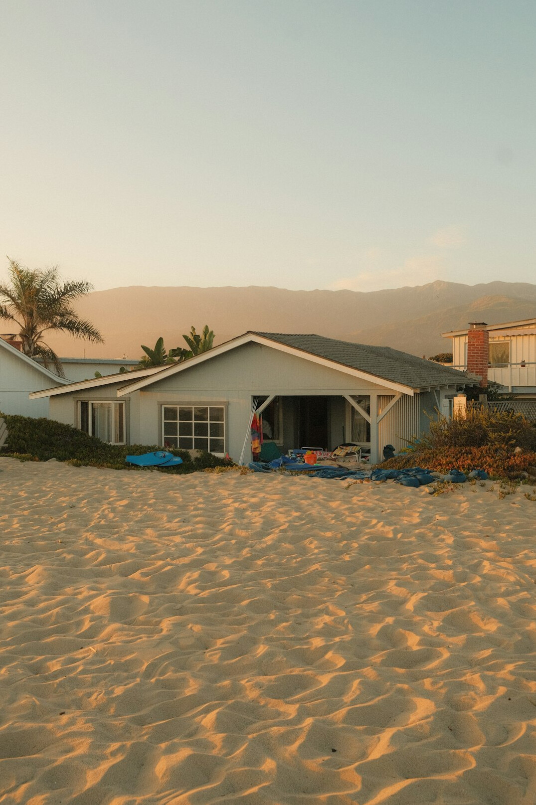 Modern minimalist oceanfront villa among sand dunes